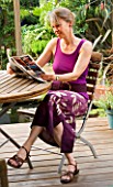 KATHY TAYLOR RELAXES IN HER LONDON GARDEN