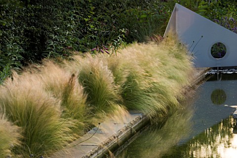 RICHARD_JACKSONS_GARDEN_DESIGNED_BY_CLARE_MATTHEWS__WATER_FEATURE__RECTANGULAR_POOL_POND_WITH_STIPA_