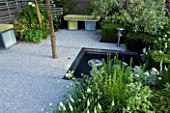 HAMPTON COURT FLOWER SHOW 2006: DESIGNER - ALISON SLOGA - SILVER  WHITE AND GREEN MODERN FORMAL CONTEMPORARY GARDEN. SEATS WITH GREEN CUSHIONS  GRAVEL  SAMLL FORMAL POND  POOL