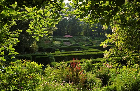 VEDDW_HOUSE_GARDEN__GWENT__WALES_DESIGNERS_ANNE_WAREHAM_AND_CHARLES_HAWES__VIEW_TO_THE_GRASSES_PARTE