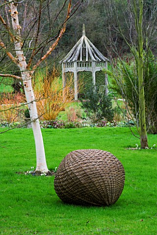 WOODPECKERS__WARWICKSHIRE__WINTER_WOVEN_WILLOW_BALL_SCULPTURE_WITH_BETULA_HERGEST_AND_A_WOODEN_PERGO