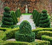 WOODPECKERS  WARWICKSHIRE  WINTER: FORMAL KNOT GARDEN WITH BOX TOPIARY   PATH AND STATUE AT END OF VISTA