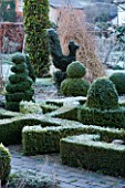 WOODPECKERS  WARWICKSHIRE  WINTER: THE FORMAL TOPIARY GARDEN IN FROST WITH KNOT GARDEN AND BOX TOPIARY TWIRLS AND CHICKEN