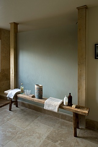 BOONSHILL_FARM__EAST_SUSSEX_INTERIOR_OF_BATHROOM_WITH_WOODEN_BENCH_WITH_MOTHER_OF_PEARL_INLAY_FROM_I