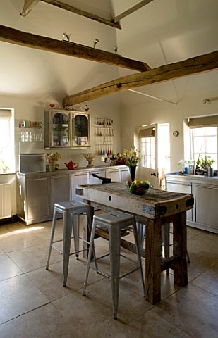 BOONSHILL_FARM__E_SUSSEX_KITCHEN_WITH_BUTCHERS_BLOCK_ON_STAND_BY_MICK_SHAW_INDUSTRIAL_STAINLESS_STEE