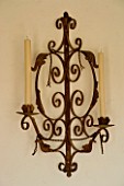 BOONSHILL FARM  EAST SUSSEX. METAL WALL-MOUNTED CANDLE HOLDER.  DESIGNER : LISETTE PLEASANCE