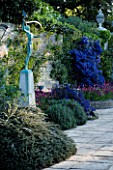 PASHLEY MANOR  EAST SUSSEX: THE SWIMMING POOL GARDEN WITH CEANOTHUS AND WALLFLOWERS