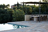 CORFU  GREECE: VILLA ZOGRAFIA  NORTH EAST CORFU. DESIGN BY ALITHEA JOHNS OF SKOPOS DESIGN AND RAHDY ELWAN. SWIMMING POOL AND PATIO DINING AREA IN EARLY MORNING. RELAXATION