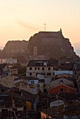 CORFU  GREECE: VIEW OF CORFU TOWN ROOFTOPS AND THE OLD FORTRESS AT DAWN