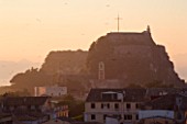 CORFU  GREECE: VIEW OF CORFU TOWN ROOFTOPS AND THE OLD FORTRESS AT DAWN