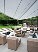 CONTEMPORARY TOWN/CITY/URBAN GARDEN DESIGNED BY CHARLOTTE SANDERSON: ENTERTAINING/RELAXING AREA WITH AWNING  TABLE  CHAIRS  SOFAS AND BARBEQUE AREA TO THE RIGHT
