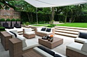 CONTEMPORARY TOWN/CITY/URBAN GARDEN DESIGNED BY CHARLOTTE SANDERSON: ENTERTAINING/RELAXING AREA WITH AWNING OVER TABLE  CHAIRS AND SOFAS WITH STEPS LEADING TO LAWN