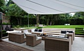 CONTEMPORARY TOWN/CITY/URBAN GARDEN DESIGNED BY CHARLOTTE SANDERSON: AWNING OVER ENTERTAINING/RELAXING/DINING AREA WITH STEPS LEADING TO LAWN