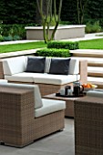 CONTEMPORARY TOWN/CITY/URBAN GARDEN DESIGNED BY CHARLOTTE SANDERSON: OUTDOOR FURNITURE - TABLE AND SOFAS WITH CUSHIONS FOR RELAXING