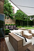 CONTEMPORARY TOWN/CITY/URBAN GARDEN DESIGNED BY CHARLOTTE SANDERSON: ENTERTAINING/RELAXING/DINING AREA WITH AWNING AND SOFA/CHAIRS