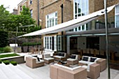 CONTEMPORARY TOWN/CITY/URBAN GARDEN DESIGNED BY CHARLOTTE SANDERSON: AWNING OVER ENTERTAINING/RELAXING/DINING AREA WITH TABLE  CHAIRS AND SOFAS