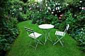 AMELIA HEATH GARDEN  1  CROSS VILLAS  SHROPSHIRE: THE SECRET GARDEN WITH LAWN  WOODEN TABLE AND CHAIRS
