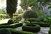 DESIGNER DOMINIQUE LAFOURCADE  PROVENCE  FRANCE - BEAUTIFUL CLIPPED BOX PARTERRE WITH PEBBLE PATH IN EVENING LIGHT