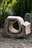 PROVENCE  FRANCE. GARDEN OF MARCO NUCERA. WOODEN SCULPTED SEAT/ ORNAMENT BY MARCO NUCERA