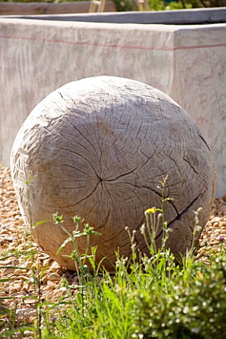 PROVENCE__FRANCE_GARDEN_OF_MARCO_NUCERA_GRAVEL_GARDEN_WITH_BEAUTIFUL_WOODEN_SCULPTURED_BALL_IN_FRONT