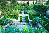 DESIGNER MICHEL SEMINI  PROVENCE  FRANCE. THE FORMAL GARDEN WITH BOX EDGED BEDS  BOX BALLS AND CYPRESSES