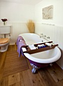 DESIGNER CLARE MATTHEWS: DEVON  THE BATHROOM WITH ROLL TOP BATH PAINTED PURPLE