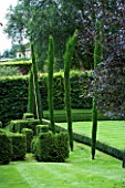 THROUGHAM COURT  GLOUCESTERSHIRE. DESIGNER: CHRISTINE FACER: TOPIARY IN THE CROQUET LAWN