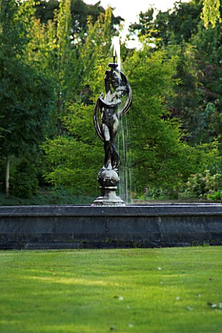 WILKINS_PLECK__STAFFORDSHIRE_VIEW_ALONG_LAWN_TO_ROUND_POOL_WITH_STATUE_AND_FOUNTAIN