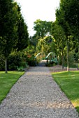 WILKINS PLECK  STAFFORDSHIRE: A GRAVEL PATH ALONG A LAWN TO A BLUE GIVERNY TYPE BRIDGE