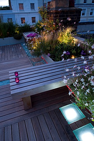 ROOF_GARDEN__HOLLAND_PARK__LONDONDESIGNERCHARLOTTE_ROWE_DECKED_TERRACE_AT_NIGHT_WITH_PINK__WHITE_LED