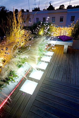ROOF_GARDEN__HOLLAND_PARK__LONDON_DESIGNER_CHARLOTTE_ROWE_DECKED_TERRACE_AT_NIGHT_WITH_LED_LIGHTING_