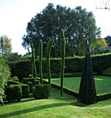 THROUGHAM COURT  GLOUCESTERSHIRE. DESIGNER: CHRISTINE FACER: TOPIARY BESIDE THE CROQUET LAWN