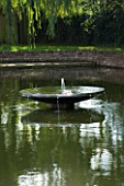 DAVID HARBER SUNDIALS: WATER FEATURE WITH DISH AND SMALL FOUNTAINS IN A LARGE POOL