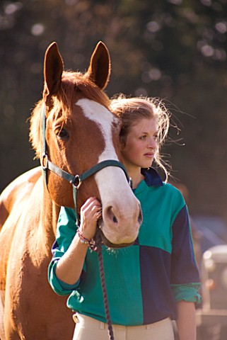 GIRL_AGED_15_AT_HORSE_JUMPING_COMPETITION_WITH_HORSE