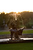 CASTLE HILL  DEVON: WATER FEATURE FOUNTAIN BY THE HOUSE BACKLIT BY EVENING SUNSHINE