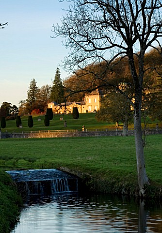 CASTLE_HILL__DEVON_VIEW_OF_THE_PALLADIAN_HOUSE_SEEN_ACROSS_THE_RIVER
