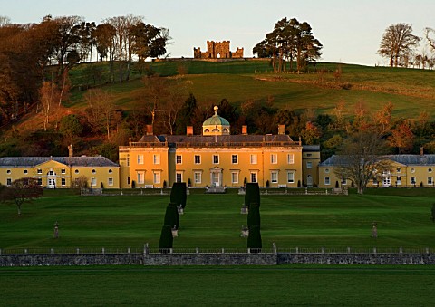CASTLE_HILL__DEVON_VIEW_OF_THE_PALLADIAN_HOUSE_SEEN_ACROSS_THE_RIVER_WITH_THE_CASTLE_BEHIND