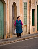 SUITE.DO. STREET SCENE WITH OLD WOMAN WALKING  SANTANYI  MALLORCA  SPAIN