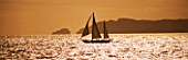 SUITE.DO. SHIP SAILING PAST CABRERA ISLAND AT SUNSET. MALLORCA  SPAIN