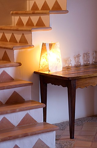 SON_BERNADINET_HOTEL__NEAR_CAMPOS__MALLORCA_SUITEDO_THE_STAIRS_WITH_TABLE__LIGHT_AND_GLASS_JARS