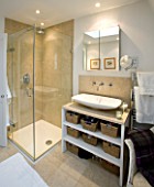 CHARLOTTE ROWES HOUSE -  THE BATHROOM SHOWING GLASS SHOWER DOORS