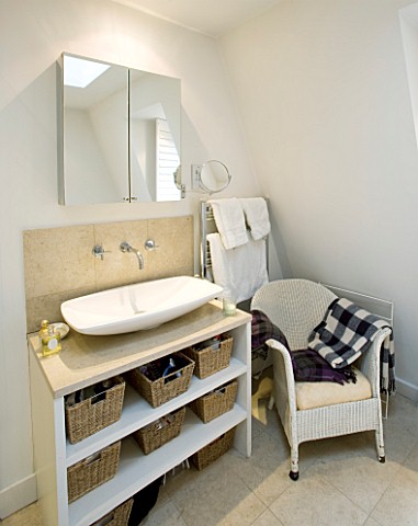 CHARLOTTE_ROWES_HOUSE___THE_BATHROOM_WITH_WHITE_SINK_AND_MIRRORED_CABINET