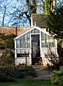 CERNEY HOUSE  GLOUCESTERSHIRE: THE OLD WALLED GARDEN WITH GREENHOUSE