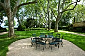 PROVENCE  FRANCE - ALTAVES. SEATING AREA IN FRONT OF HOUSE WITH LAWNED AREA AND HUGE PLANE TREES