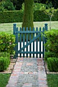 PRIVATE GARDEN  PROVENCE  FRANCE - DESIGNER DOMINIQUE LAFOURCADE. PATH WITH BLUE PAINTED WOODEN GATE