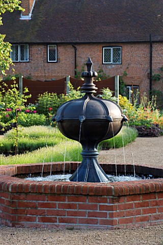THE_WALLED_GARDEN_AT_COWDRAY__WEST_SUSSEX_DESIGNER_JAN_HOWARD__RAISED_BRICK_POOLPOND_WITH_METAL_BOAR