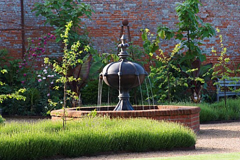 THE_WALLED_GARDEN_AT_COWDRAY__WEST_SUSSEX_DESIGNER_JAN_HOWARD__RAISED_BRICK_POOLPOND_WITH_METAL_FOUN