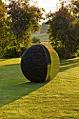 DAVID HARBER SUNDIALS: THE KERNEL SCULPTURE ON A LAWN AT DAWN