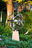 DAVID HARBER SUNDIALS: STAINLESS STEEL ARMILLARY SPHERE SUNDIAL ON A STONE PLINTH AT PETTIFERS  OXFORDSHIRE