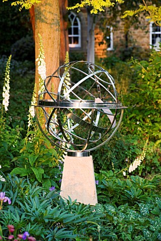 DAVID_HARBER_SUNDIALS_STAINLESS_STEEL_ARMILLARY_SPHERE_SUNDIAL_ON_A_STONE_PLINTH_AT_PETTIFERS__OXFOR